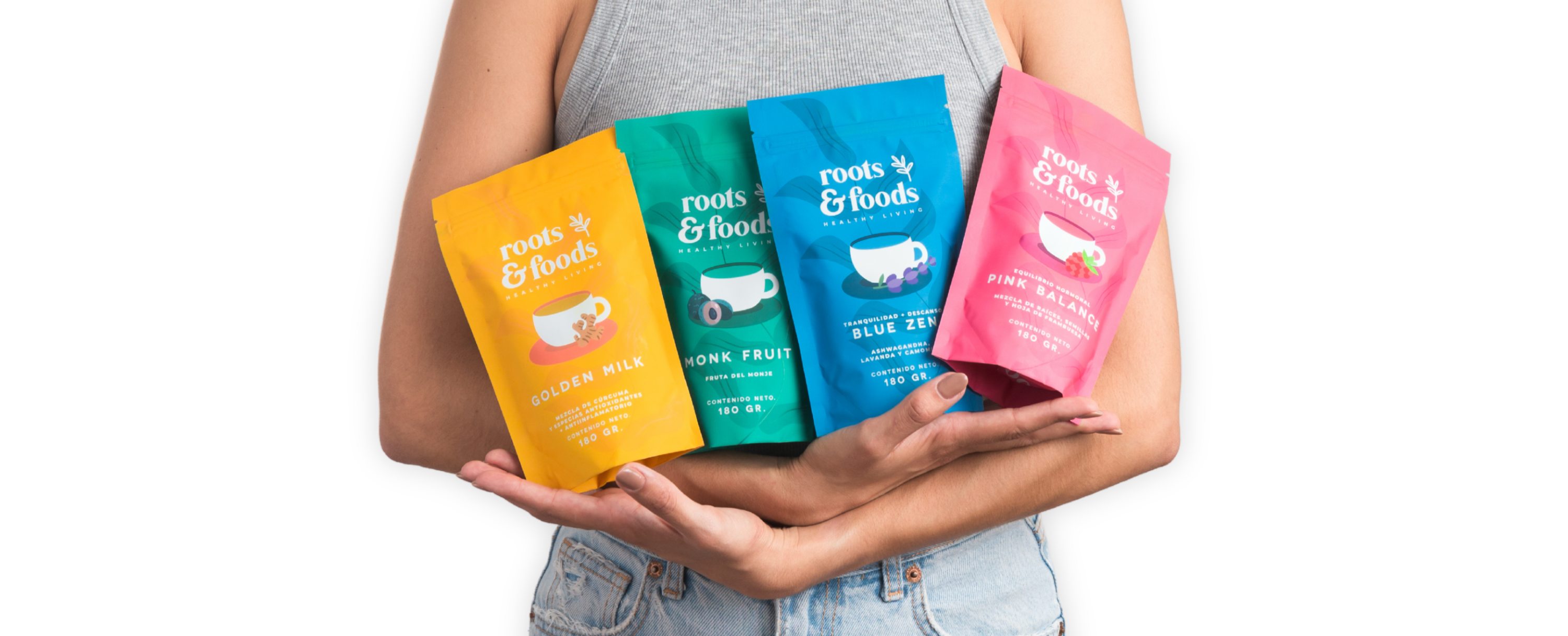 Linea de productos de Roots and Foods abrazados por mujer joven